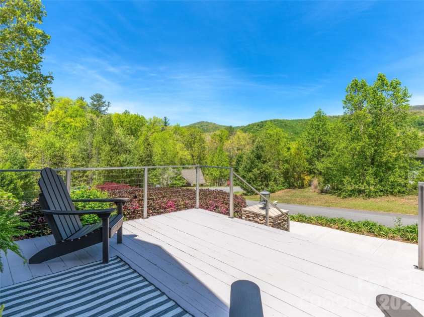 16 Chickadee Lane, Fairview, NC 28730.  MLS# CAR4375126, YatesRealty ID 18349. Lovely front porch for mountain viewing