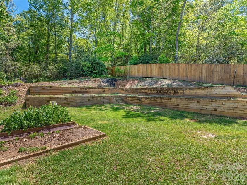 16 Chickadee Lane, Fairview, NC 28730.  MLS# CAR4375126, YatesRealty ID 18349. Terraced gardens