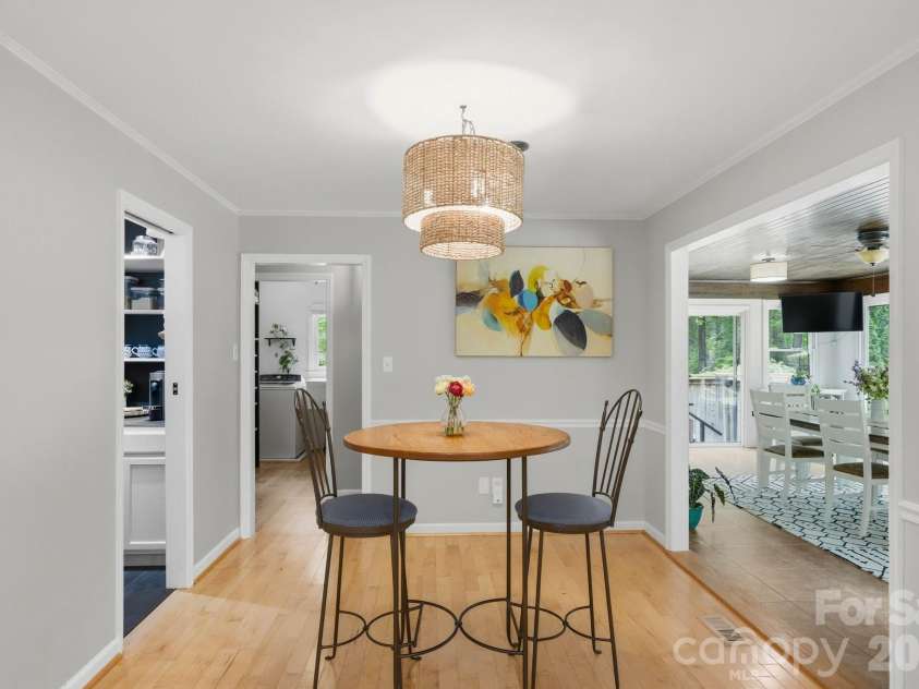 20200 Floral Lane, Cornelius, NC 28031.  MLS# CAR4374755, YatesRealty ID 18352. Breakfast Room open to a large sunroom