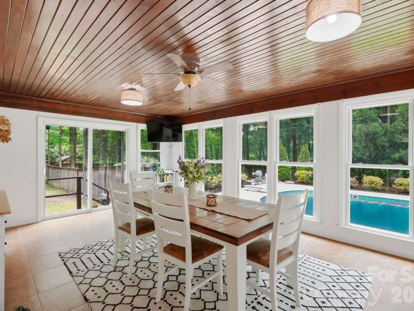 20200 Floral Lane, Cornelius, NC 28031.  MLS# CAR4374755, YatesRealty ID 18352. Sunroom overlooking the pool