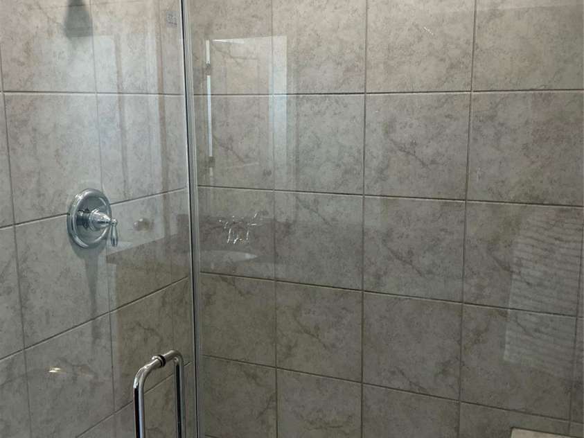 9240 Walnut Hill Road, Concord, NC 28027.  MLS# CAR4330355, YatesRealty ID 18358. Large tiled shower w/built-in bench seating