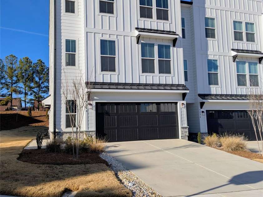 9240 Walnut Hill Road, Concord, NC 28027.  MLS# CAR4330355, YatesRealty ID 18358. Modern white architecture w/black accents. End unit. Private
