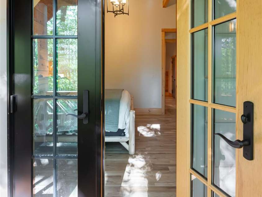 103 Blue Sky Lane, Hendersonville, NC 28792.  MLS# CAR4268920, YatesRealty ID 18359. Doorway to upper bedroom from deck
