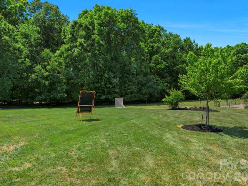 7122 Yellowhorn Trail, Waxhaw, NC 28173.  MLS# CAR4310525, YatesRealty ID 18360. Deep & Wooded Lush backyard 