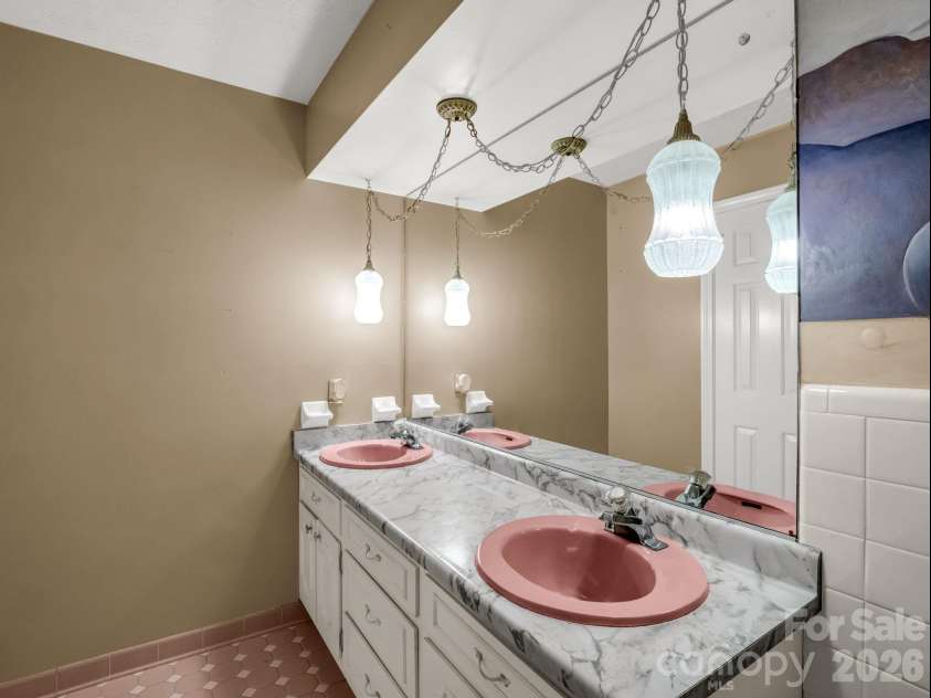 1867 Fruitland Road, Hendersonville, NC 28792.  MLS# CAR4322794, YatesRealty ID 18363. Hall bath with double sinks