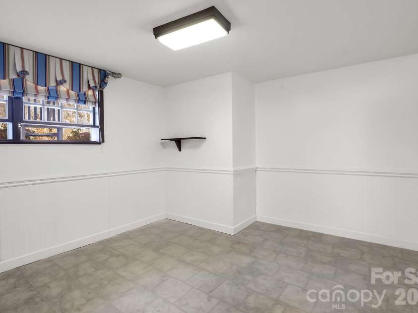 1867 Fruitland Road, Hendersonville, NC 28792.  MLS# CAR4322794, YatesRealty ID 18363. Second lower level flex room