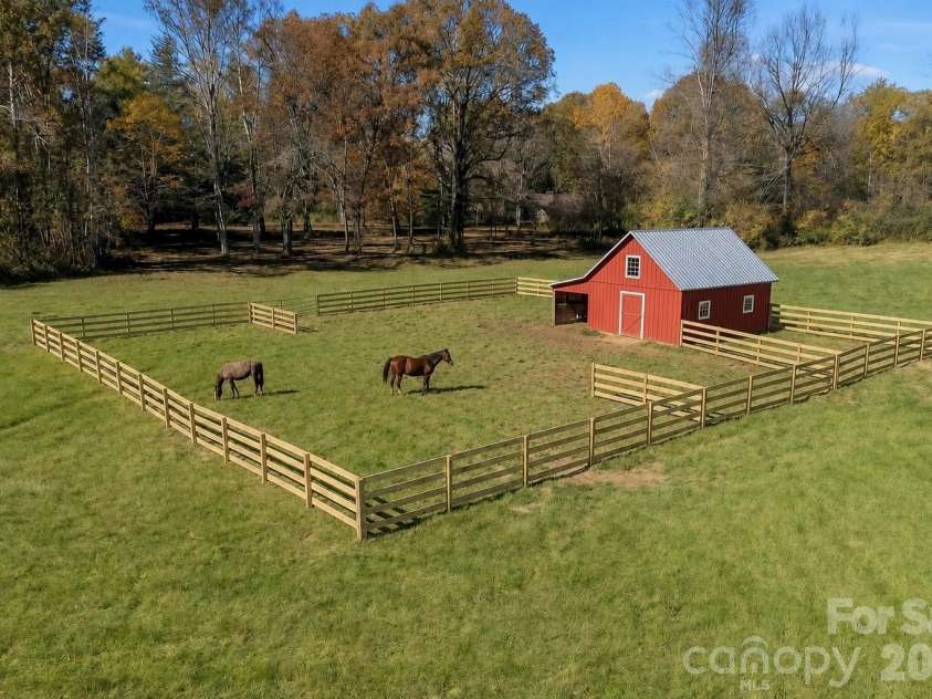 1867 Fruitland Road, Hendersonville, NC 28792.  MLS# CAR4322794, YatesRealty ID 18363. Virtually staged front field - would make an excellent horse farm!