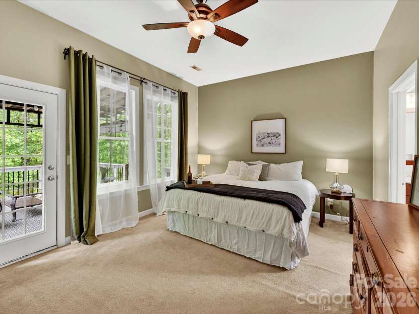 18721 The Commons Boulevard, Cornelius, NC 28031.  MLS# CAR4373232, YatesRealty ID 18371. Spacious primary suite featuring vaulted ceilings, abundant natural light, and a private ensuite—creating a peaceful retreat.