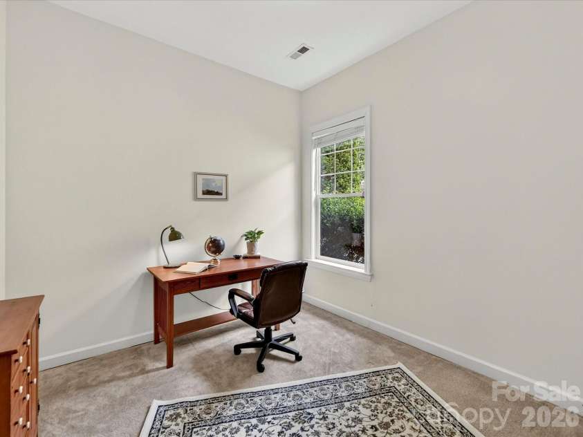 18721 The Commons Boulevard, Cornelius, NC 28031.  MLS# CAR4373232, YatesRealty ID 18371. Versatile secondary bedroom with soft carpeting and natural light, ideal for a guest room, home office, or flex space.