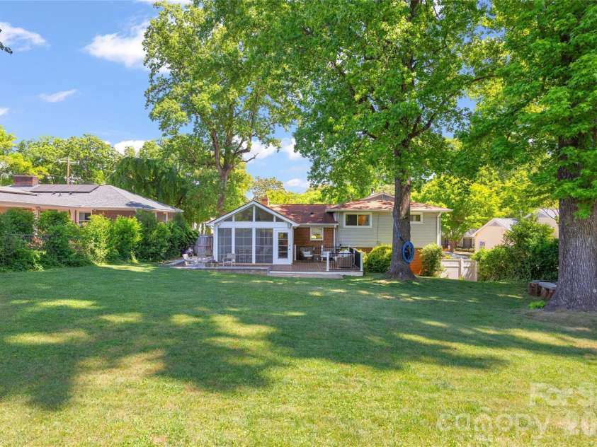 832 Stanfield Drive, Charlotte, NC 28210.  MLS# CAR4369316, YatesRealty ID 18372. Rear view of backyard