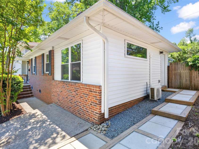 832 Stanfield Drive, Charlotte, NC 28210.  MLS# CAR4369316, YatesRealty ID 18372. Side entrance with new sidewalk