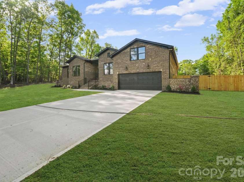 311 Hudson Drive, Harrisburg, NC 28075.  MLS# CAR4333304, YatesRealty ID 18374. Virtual potential grass- seed and straw recently done
