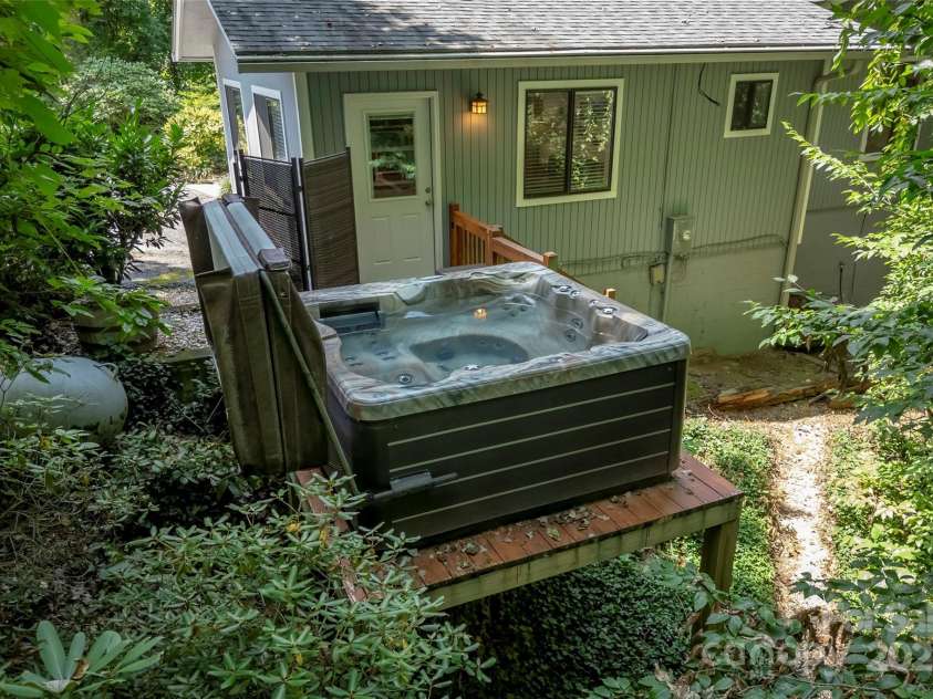 60 Holly Ridge Road, Pisgah Forest, NC 28768.  MLS# CAR4171351, YatesRealty ID 18375. Hot tub located outside bonus room