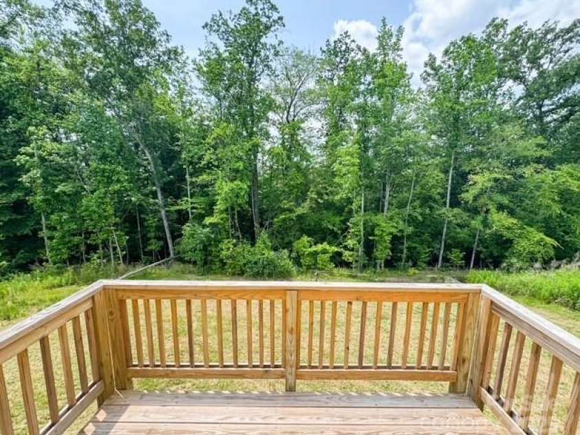 7601 Hammond Drive, Charlotte, NC 28215.  MLS# CAR4267514, YatesRealty ID 18378. Rear deck, view of trees instead of another neighbor's backyard