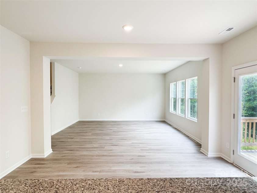 7601 Hammond Drive, Charlotte, NC 28215.  MLS# CAR4267514, YatesRealty ID 18378. View 2 -Kitchen Island looking into spacious living room