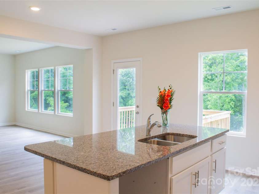 7601 Hammond Drive, Charlotte, NC 28215.  MLS# CAR4267514, YatesRealty ID 18378. View from kitchen Island into living room.