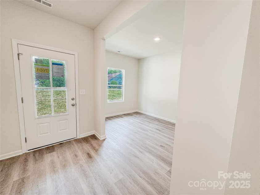 7601 Hammond Drive, Charlotte, NC 28215.  MLS# CAR4267514, YatesRealty ID 18378. View of foyer and entry to flex space