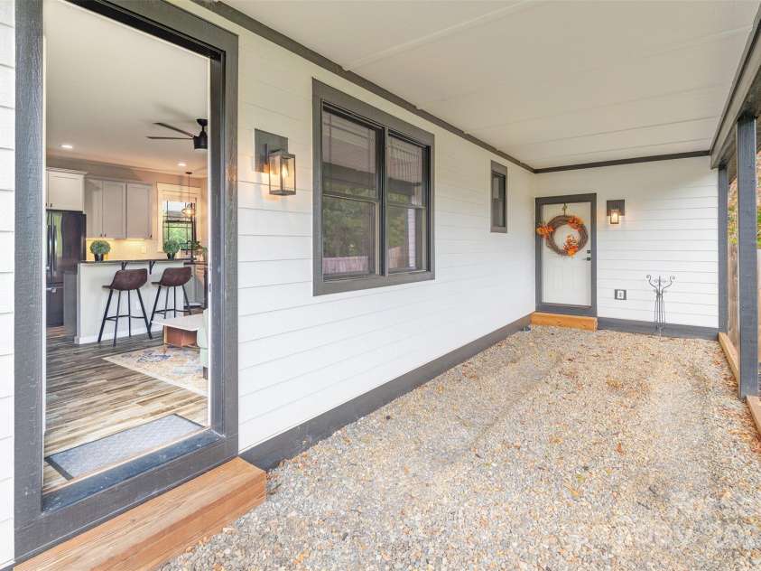 45 Erin Glen Court, Fairview, NC 28730.  MLS# CAR4239316, YatesRealty ID 18382. Attached carport with private entry into in law suite