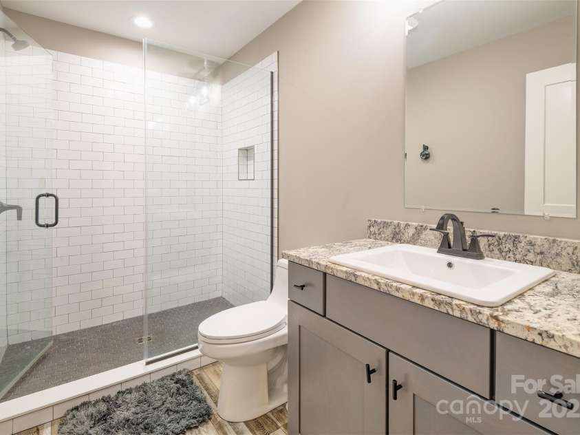 45 Erin Glen Court, Fairview, NC 28730.  MLS# CAR4239316, YatesRealty ID 18382. Bedroom 2 en suite bathroom