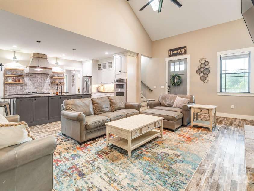 45 Erin Glen Court, Fairview, NC 28730.  MLS# CAR4239316, YatesRealty ID 18382. Great room looking toward the kitchen