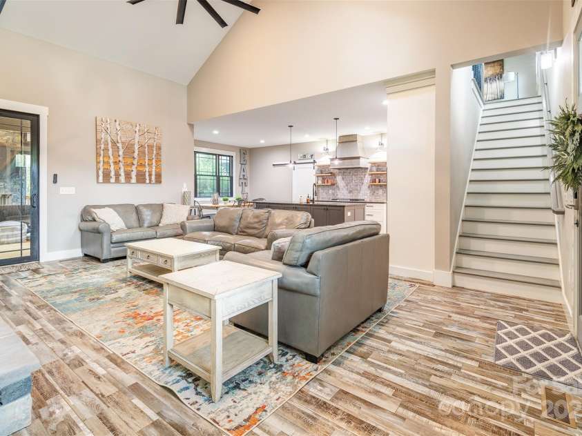 45 Erin Glen Court, Fairview, NC 28730.  MLS# CAR4239316, YatesRealty ID 18382. Great room looking towards the upstairs and the kitchen