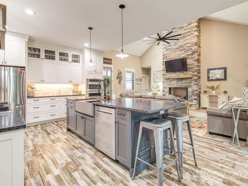 45 Erin Glen Court, Fairview, NC 28730.  MLS# CAR4239316, YatesRealty ID 18382. Looking from the pantry / dining area across the kitchen