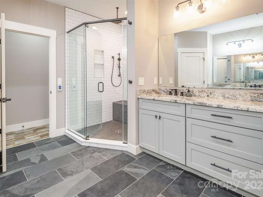 45 Erin Glen Court, Fairview, NC 28730.  MLS# CAR4239316, YatesRealty ID 18382. Primary bathroom- heated floors and dual vanities