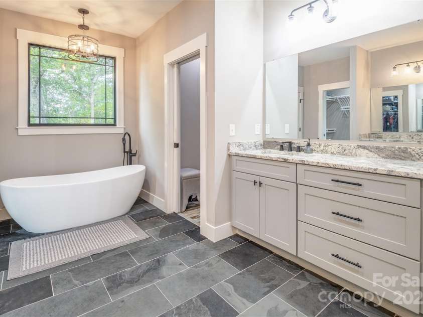 45 Erin Glen Court, Fairview, NC 28730.  MLS# CAR4239316, YatesRealty ID 18382. Primary bathroom opposite view with soaker tub
