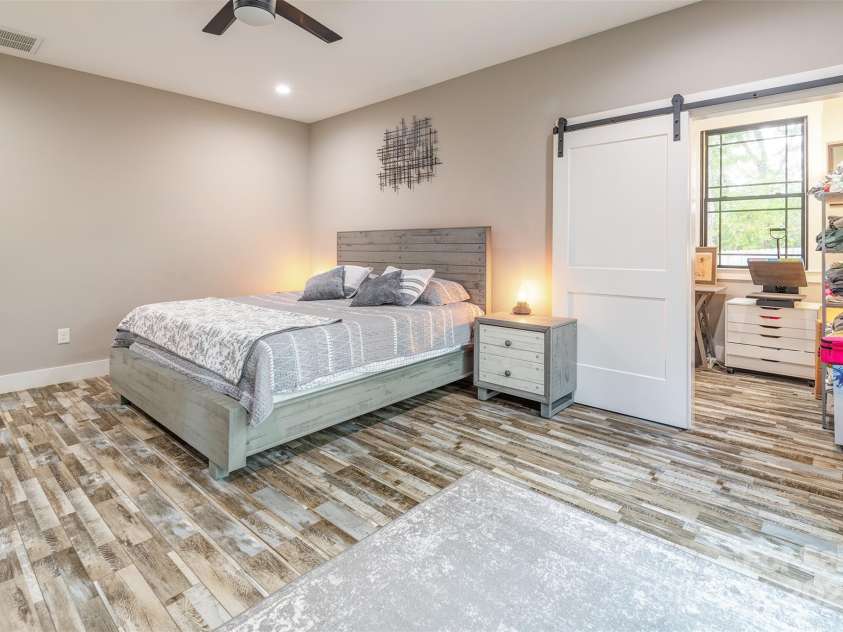 45 Erin Glen Court, Fairview, NC 28730.  MLS# CAR4239316, YatesRealty ID 18382. Primary Bedroom with sliding barn door to office space