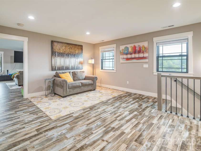 45 Erin Glen Court, Fairview, NC 28730.  MLS# CAR4239316, YatesRealty ID 18382. Upstairs sitting room / multipurpose room with large bonus room through the door on the left