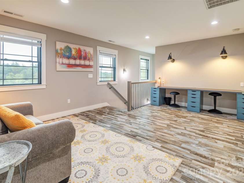 45 Erin Glen Court, Fairview, NC 28730.  MLS# CAR4239316, YatesRealty ID 18382. View of the upstairs multipurpose room from the bonus room door