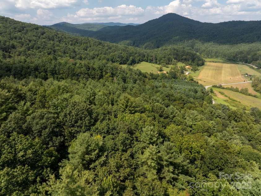 721 Kuenzel Eller Drive, Millers Creek, NC 28651.  MLS# CAR4179124, YatesRealty ID 184. Far away view of open land with mountains in the distance