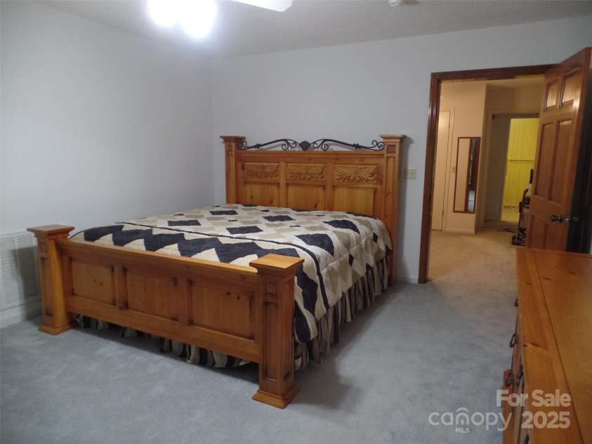 721 Kuenzel Eller Drive, Millers Creek, NC 28651.  MLS# CAR4179124, YatesRealty ID 184. King Sized Bed and furniture to remain in this room that looks out on the deck