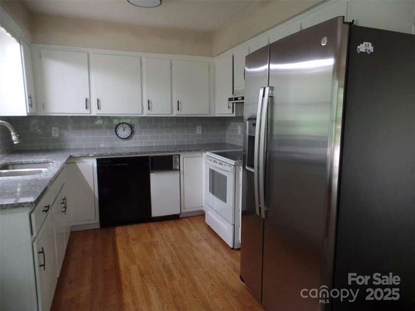 721 Kuenzel Eller Drive, Millers Creek, NC 28651.  MLS# CAR4179124, YatesRealty ID 184. Kitchen updated with new counter-tops and new Side-By-Side Refrigerator. Range/Oven,Dishwasher,Trash compactor