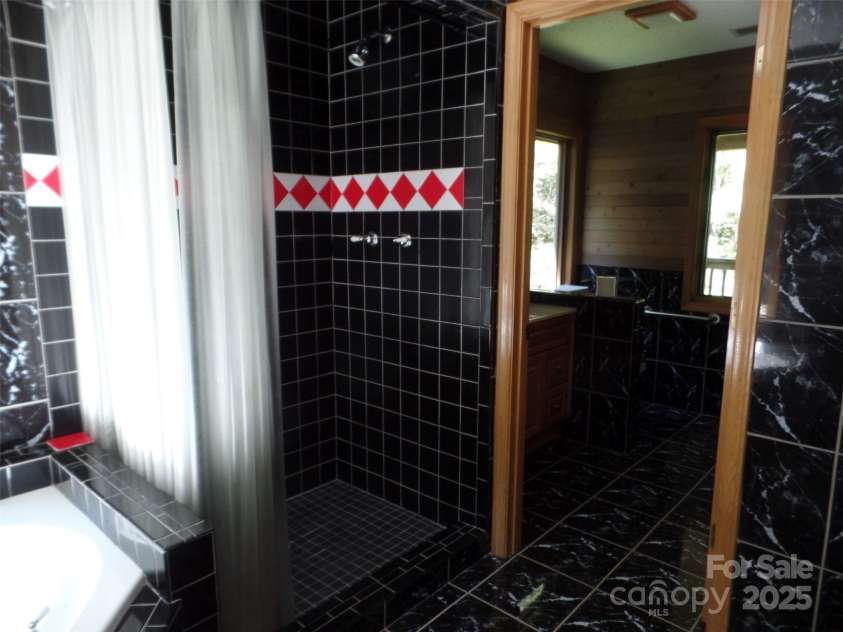 721 Kuenzel Eller Drive, Millers Creek, NC 28651.  MLS# CAR4179124, YatesRealty ID 184. Upper level Shower and Jacuzzi tub