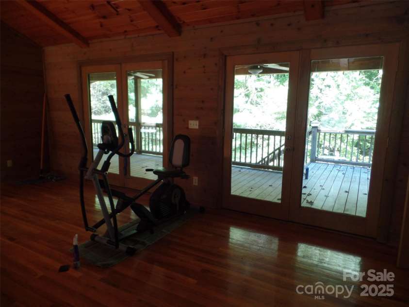 721 Kuenzel Eller Drive, Millers Creek, NC 28651.  MLS# CAR4179124, YatesRealty ID 184. View from Bedroom/Exercise Room onto Deck