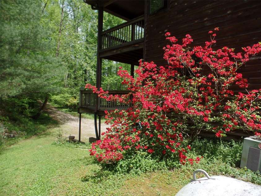 721 Kuenzel Eller Drive, Millers Creek, NC 28651.  MLS# CAR4179124, YatesRealty ID 184. View of Deck from side of home.