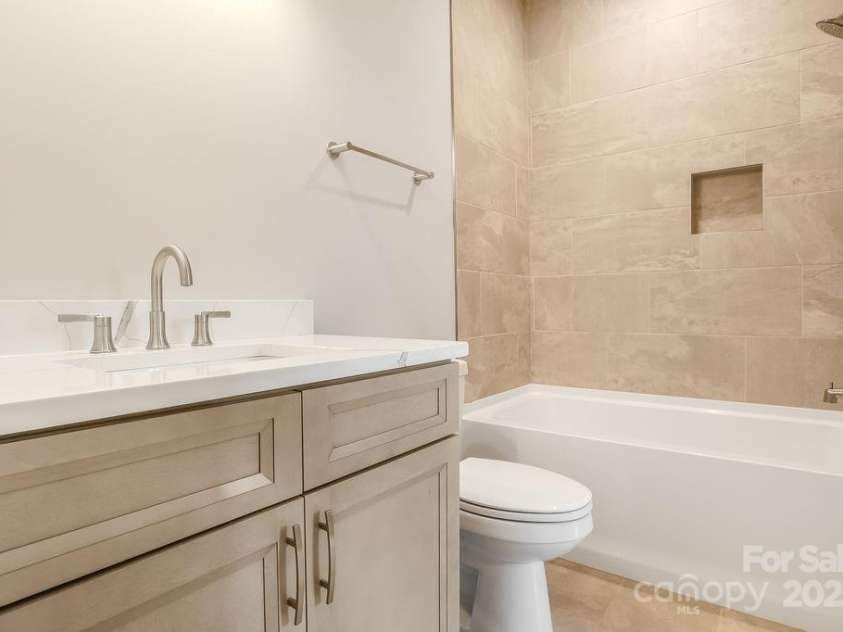 21 Craftsman Overlook Ridge, Arden, NC 28704.  MLS# CAR4007643, YatesRealty ID 18407. Secondary main level guest bathroom.