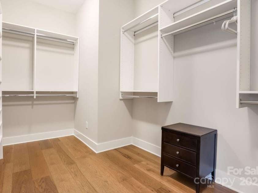 21 Craftsman Overlook Ridge, Arden, NC 28704.  MLS# CAR4007643, YatesRealty ID 18407. Spacious walk-in closet with built in shelving.