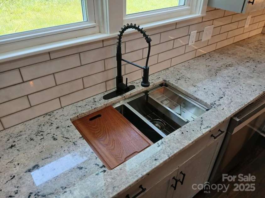 105 Inman Avenue, Bessemer City, NC 28016.  MLS# CAR4219453, YatesRealty ID 18408. Stainless Steel Workstation sink with Basin Rack, Colander and Wooden Cutting Board