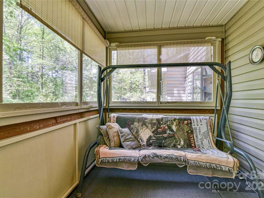 145 Fox Glen Drive, Arden, NC 28704.  MLS# CAR4134713, YatesRealty ID 18409. 2nd view of enclosed porch (no permanent heat)