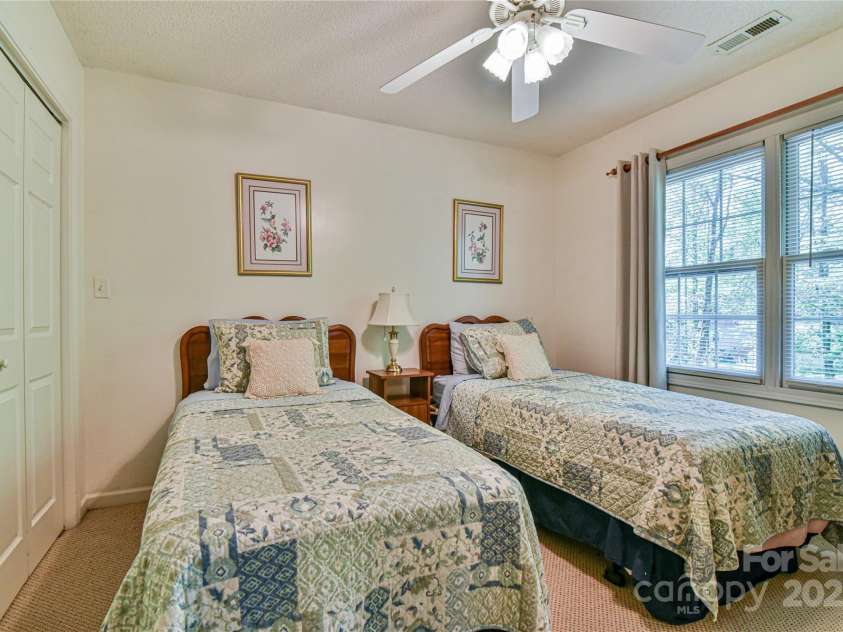 145 Fox Glen Drive, Arden, NC 28704.  MLS# CAR4134713, YatesRealty ID 18409. Guest bedroom on 2nd level