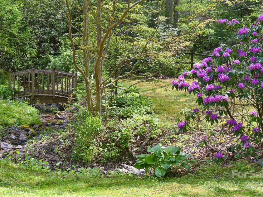 145 Fox Glen Drive, Arden, NC 28704.  MLS# CAR4134713, YatesRealty ID 18409. Lush landscaping