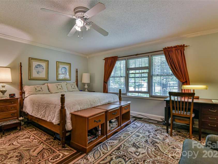 145 Fox Glen Drive, Arden, NC 28704.  MLS# CAR4134713, YatesRealty ID 18409. Main level spacious primary bedroom
