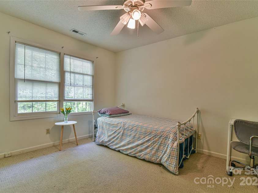 145 Fox Glen Drive, Arden, NC 28704.  MLS# CAR4134713, YatesRealty ID 18409. Second guest bedroom with large storage closet on wall opposite of windows.