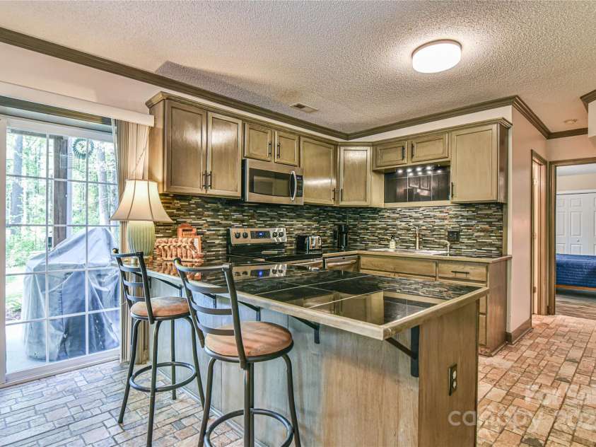 145 Fox Glen Drive, Arden, NC 28704.  MLS# CAR4134713, YatesRealty ID 18409. Spacious full kitchen in apartment with tile floors