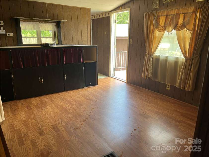 68 Cornwell Drive, Waynesville, NC 28786.  MLS# CAR4265358, YatesRealty ID 18412. Living room towards front door