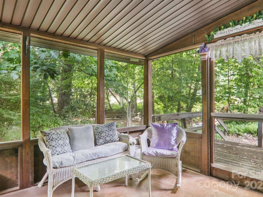 68 Cornwell Drive, Waynesville, NC 28786.  MLS# CAR4265358, YatesRealty ID 18412. Private screened-in back porch off living room