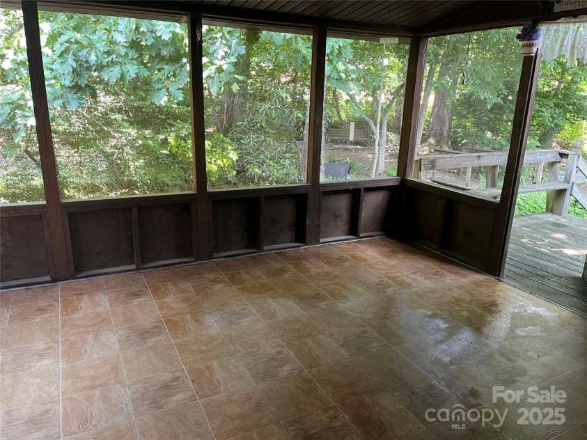 68 Cornwell Drive, Waynesville, NC 28786.  MLS# CAR4265358, YatesRealty ID 18412. Screened-in back porch