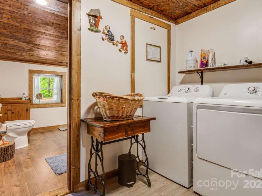 482 Pheasant Street, Lake Lure, NC 28746.  MLS# CAR4253575, YatesRealty ID 18417. Laundry and Bathroom W/D Stay
